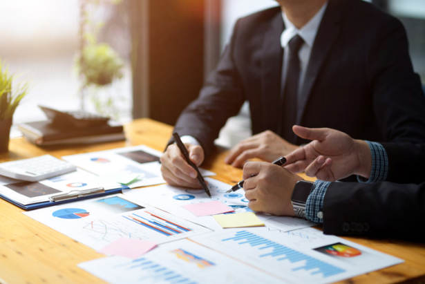 offshore asset protection trusts Business professionals reviewing financial charts while planning offshore trust management by First Anguilla Trust